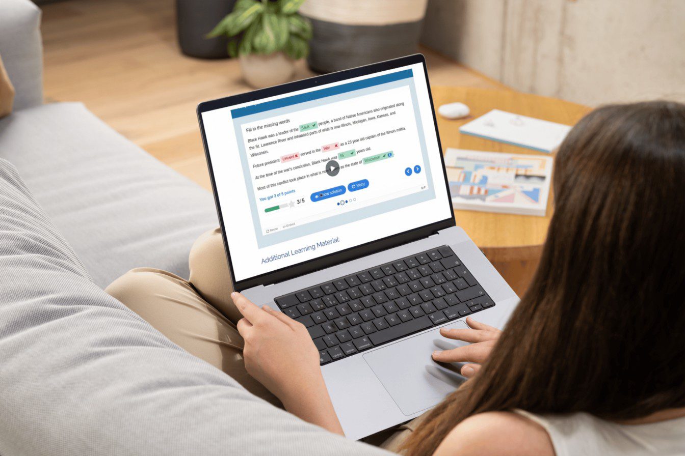 student on laptop using Pressbooks Results